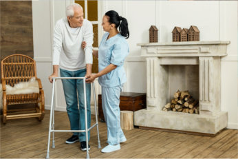 elderly on a stand being helped